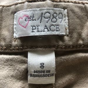 Identical pair of Bermuda shorts.